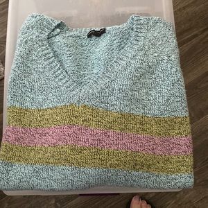 Carolyn Taylor, multicolored sweater.